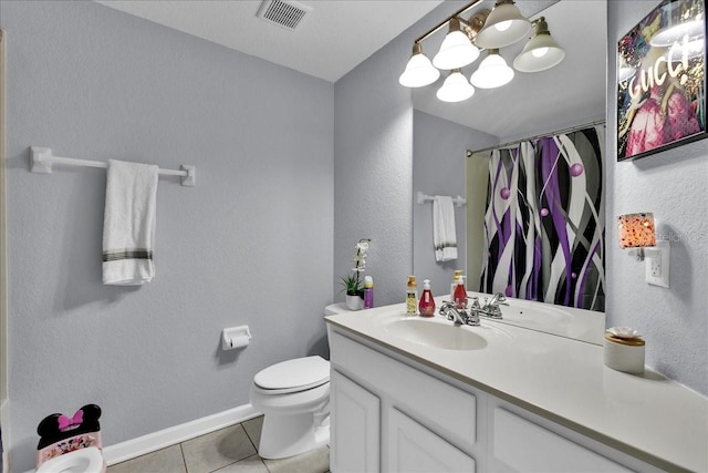 bathroom featuring a chandelier, toilet, tile floors, and oversized vanity