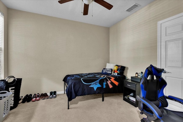 bedroom with light carpet and ceiling fan