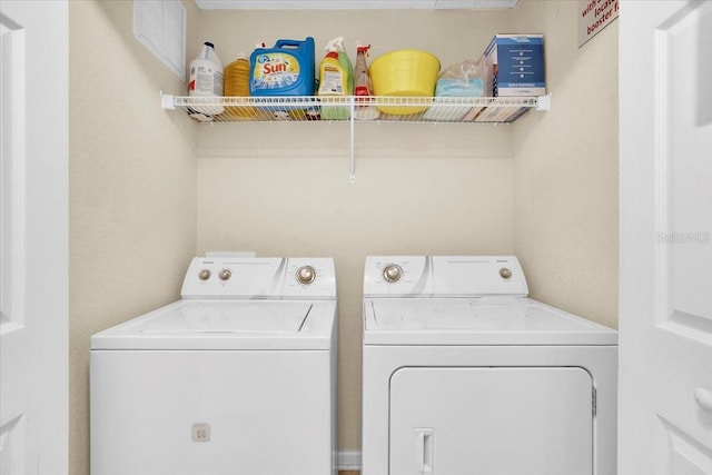 laundry room with washer and dryer