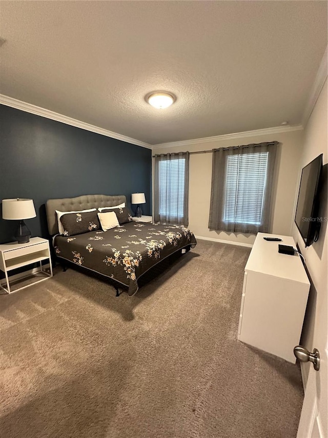 carpeted bedroom featuring ornamental molding and a textured ceiling