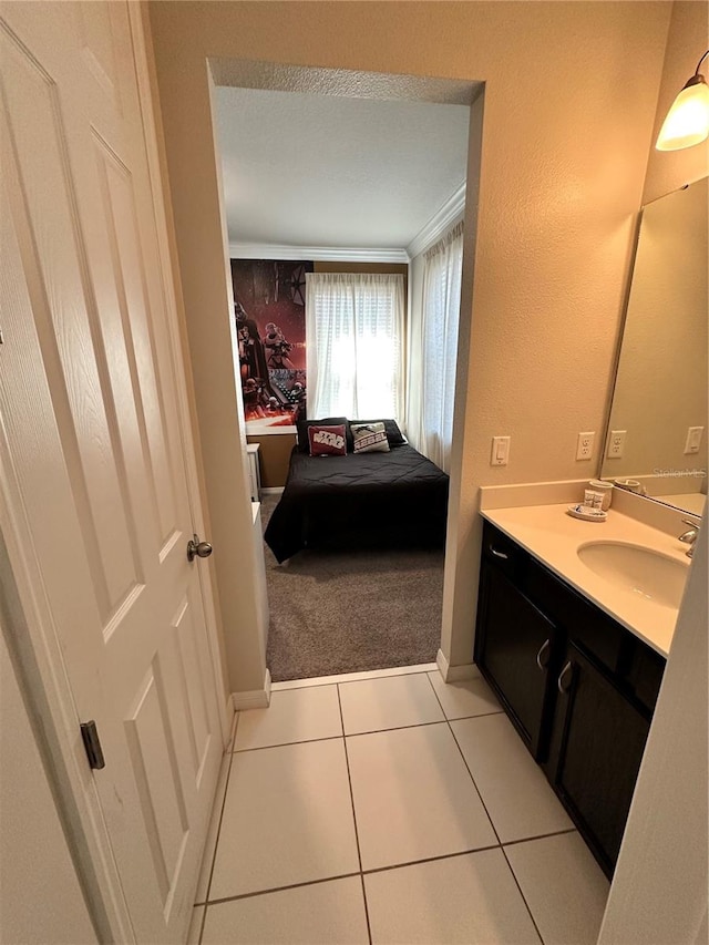 bathroom featuring a textured ceiling, large vanity, and tile floors