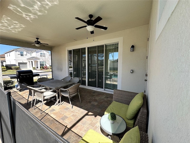 view of patio / terrace featuring ceiling fan