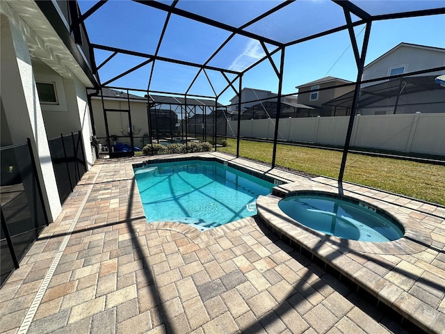 view of swimming pool with a patio area, a lawn, a lanai, and an in ground hot tub