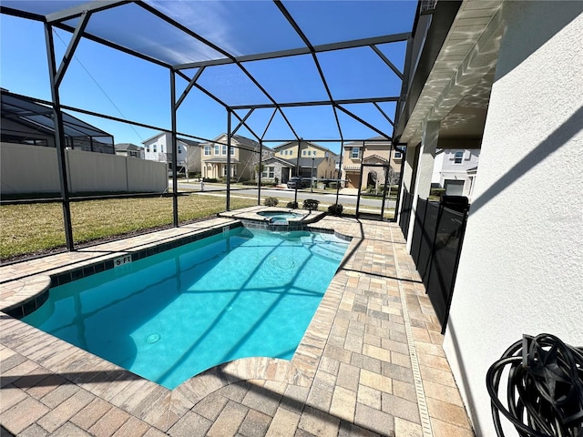 view of swimming pool with a patio area, an in ground hot tub, and glass enclosure