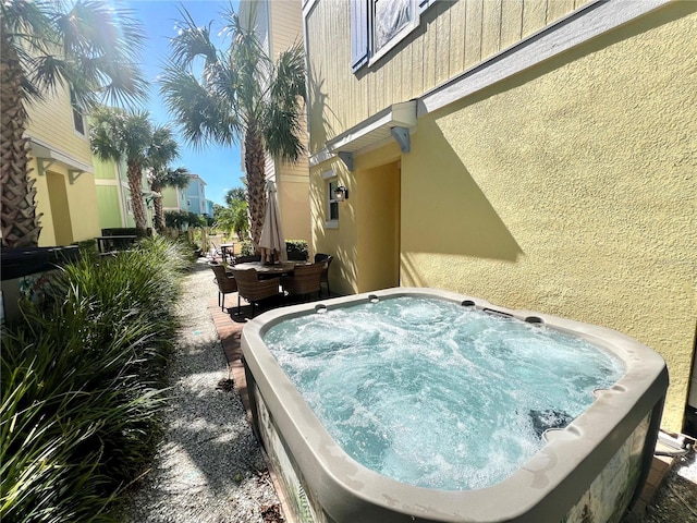 exterior space featuring a hot tub