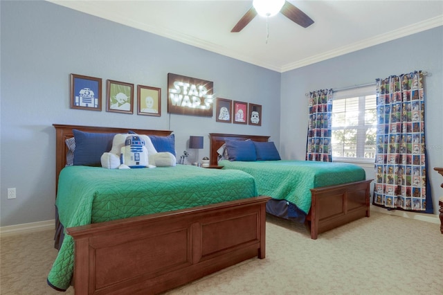 carpeted bedroom featuring ceiling fan and ornamental molding