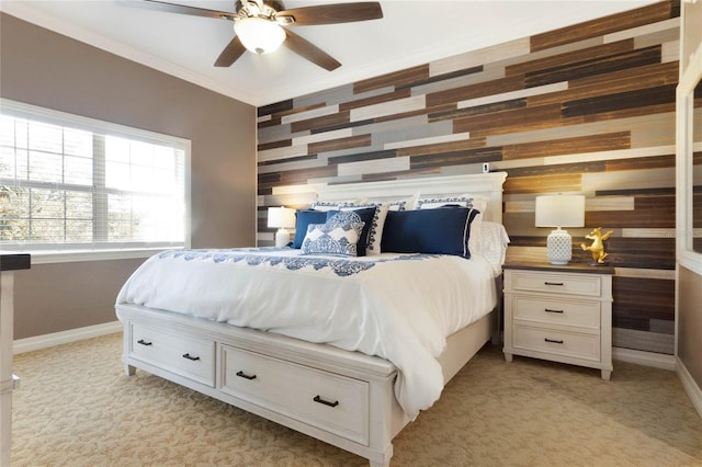 carpeted bedroom with ceiling fan and crown molding