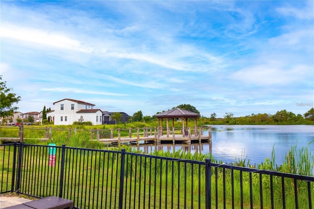 dock area featuring a gazebo and a water view