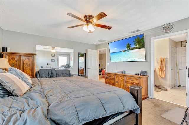 bedroom featuring light colored carpet, ceiling fan, and multiple windows