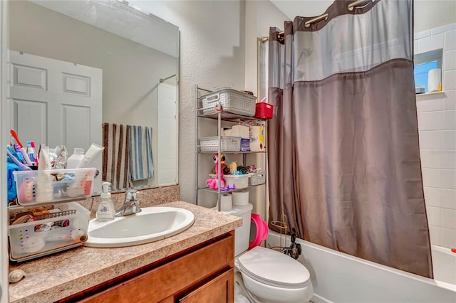 full bathroom featuring shower / bath combination with curtain, large vanity, and toilet