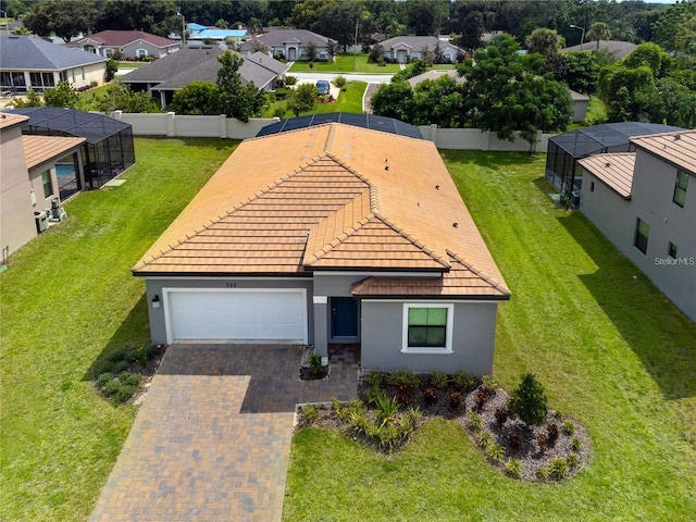 view of front of property with a front yard and a garage