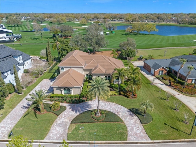 birds eye view of property featuring view of golf course, a water view, and a residential view