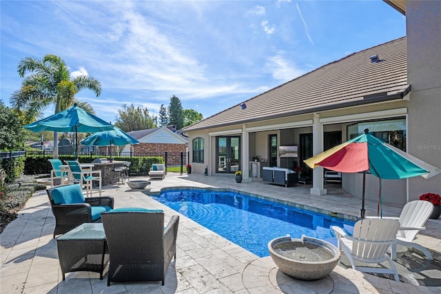 view of swimming pool with a patio