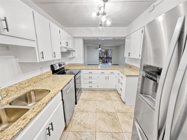 kitchen featuring white cabinets, appliances with stainless steel finishes, and sink