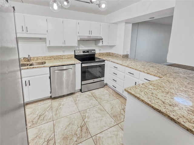 kitchen with stainless steel appliances, light stone countertops, white cabinets, and sink