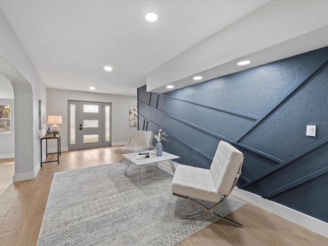 living room with a wealth of natural light and light wood-type flooring