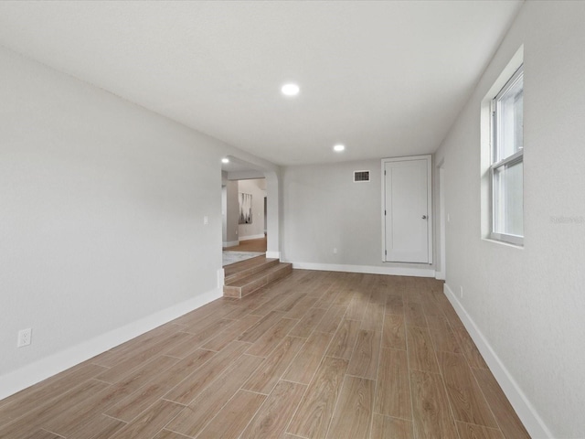 spare room featuring light hardwood / wood-style floors