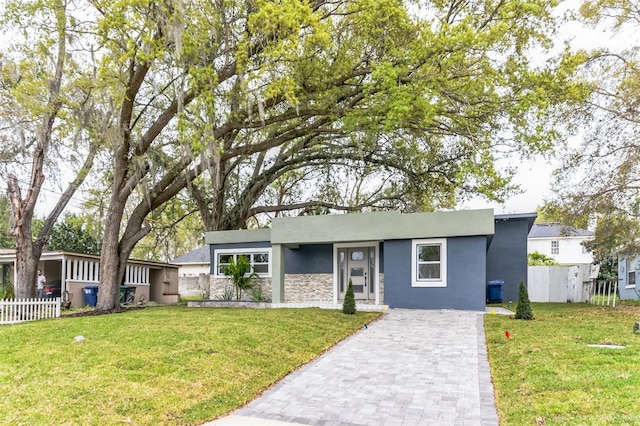 view of front of property with a front lawn