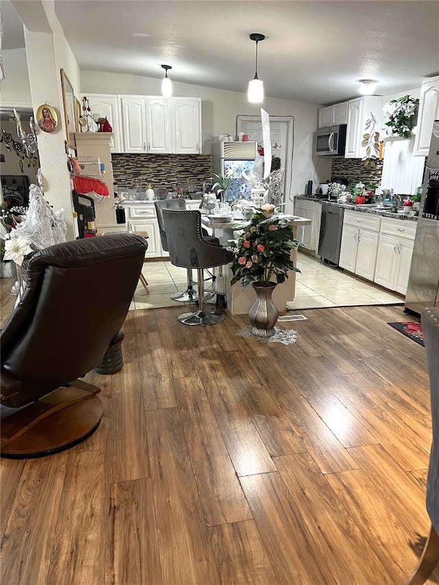 dining space with light hardwood / wood-style floors