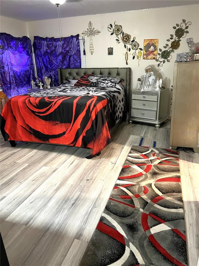 bedroom with light hardwood / wood-style flooring