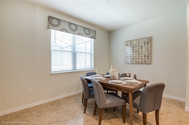 dining room featuring light tile floors