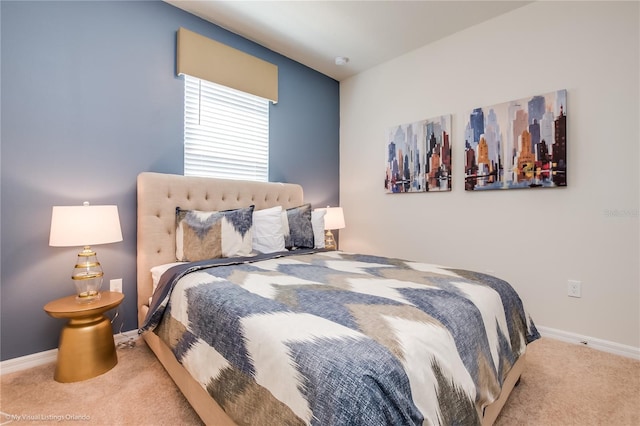 bedroom with light colored carpet