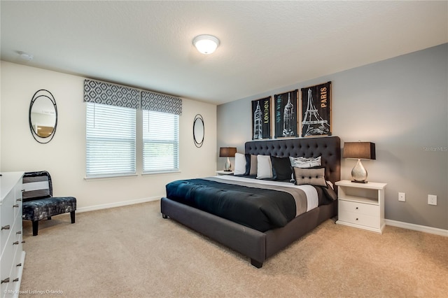 bedroom with light colored carpet