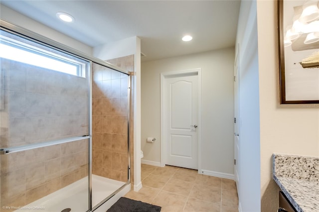 bathroom featuring an enclosed shower, toilet, vanity, and tile floors