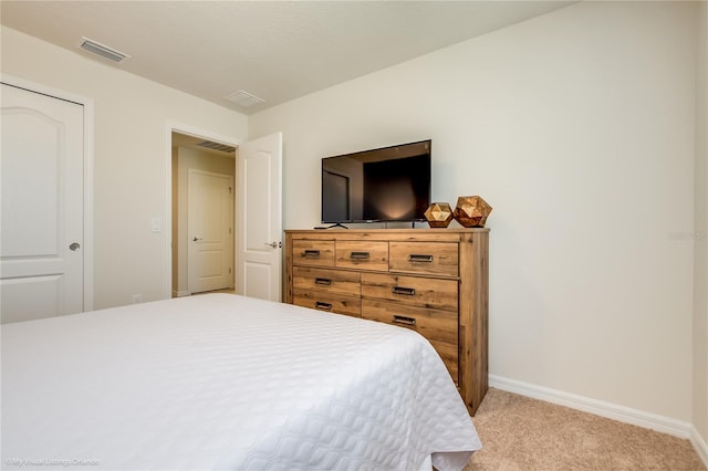 carpeted bedroom featuring a closet