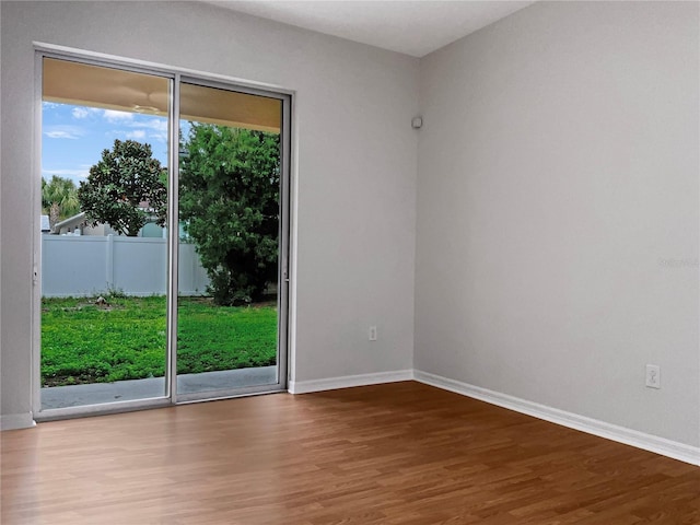 spare room featuring hardwood / wood-style floors