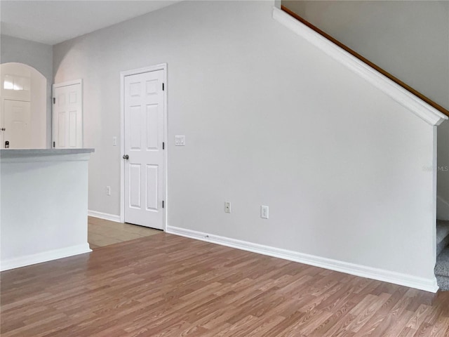 unfurnished living room featuring hardwood / wood-style floors