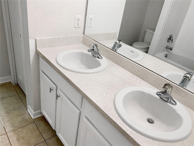 full bathroom with tub / shower combination, vanity, tile patterned flooring, and toilet