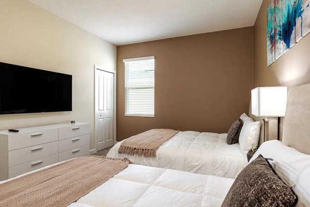 bedroom with a closet and carpet flooring