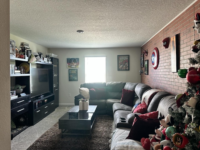 living room with carpet, brick wall, and a textured ceiling