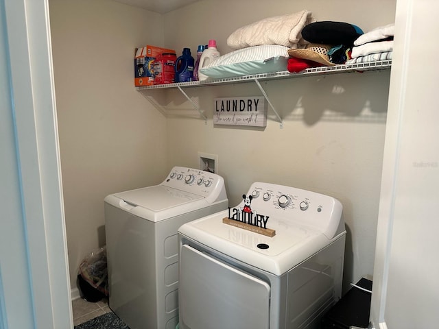 washroom featuring tile patterned floors and washing machine and clothes dryer