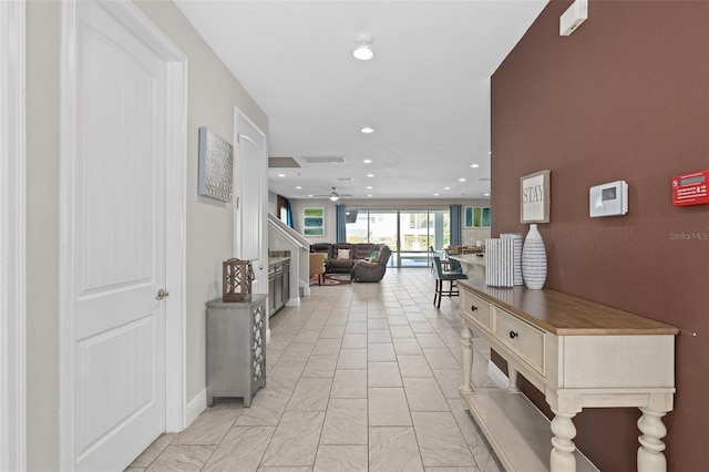 hall with light tile flooring