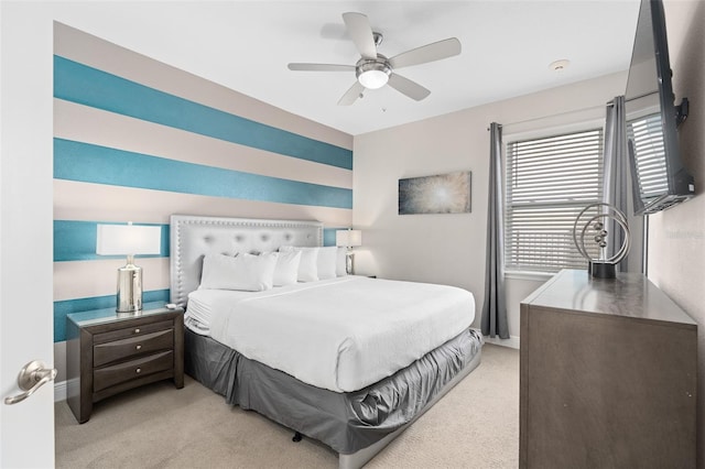 bedroom with light carpet and ceiling fan