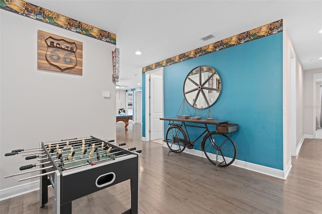 game room with dark hardwood / wood-style flooring and pool table