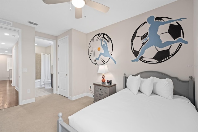 carpeted bedroom featuring ceiling fan and ensuite bathroom