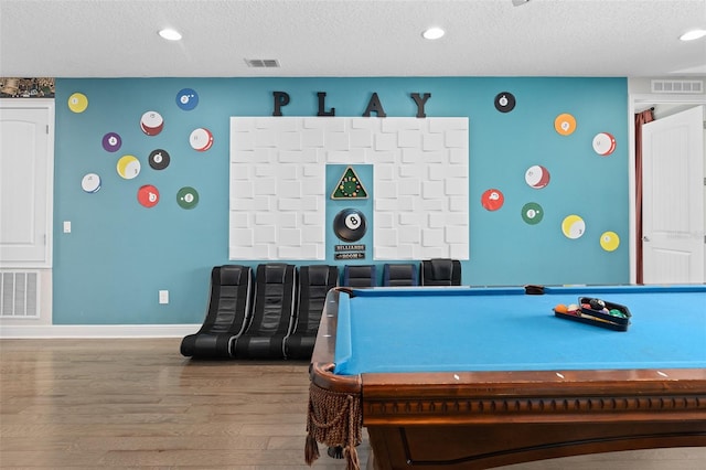 rec room featuring billiards, a textured ceiling, and wood-type flooring