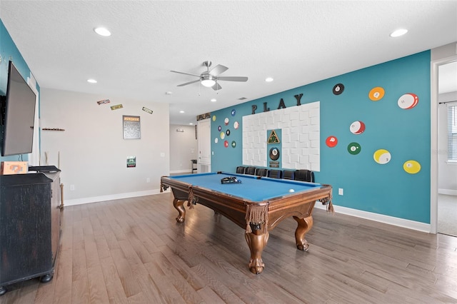 rec room with a textured ceiling, pool table, wood-type flooring, and ceiling fan