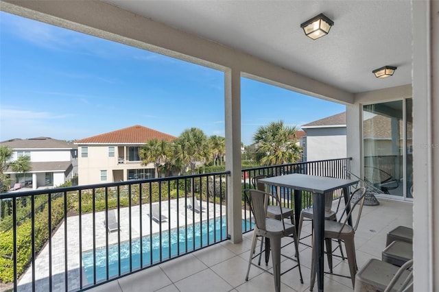 balcony with a fenced in pool