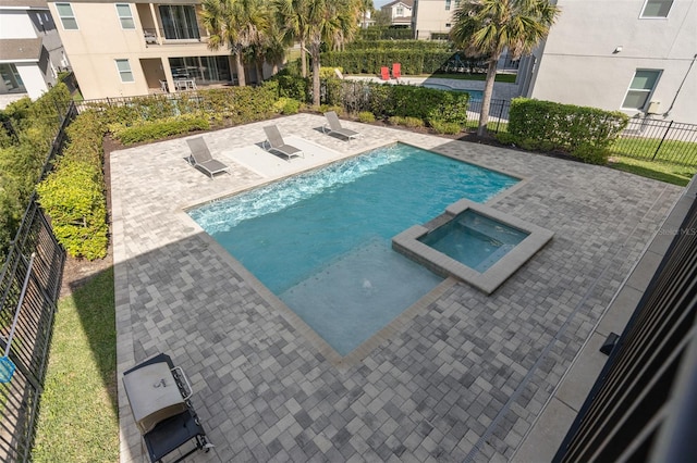 view of pool featuring a patio, an in ground hot tub, and central air condition unit