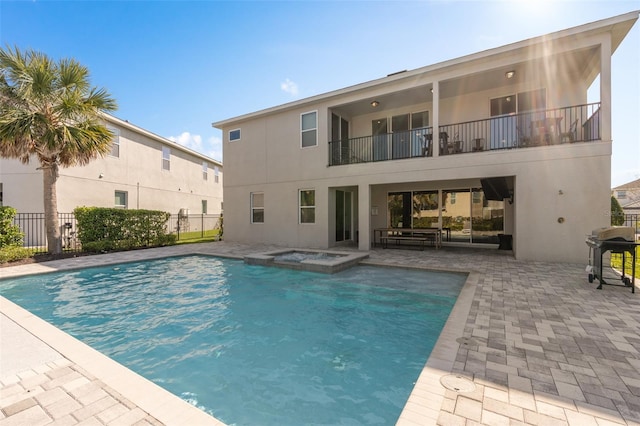 view of pool featuring grilling area and a patio area