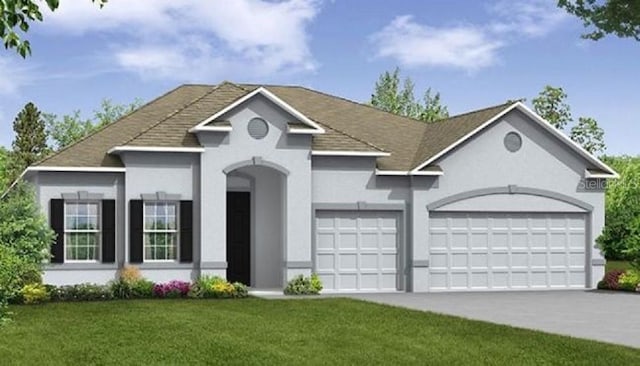 view of front of property featuring a front yard and a garage