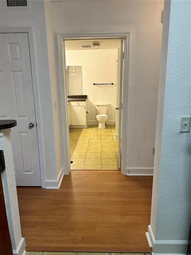 hallway featuring tile flooring