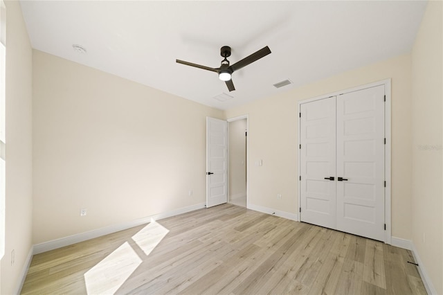 unfurnished bedroom featuring a closet, ceiling fan, and light hardwood / wood-style flooring