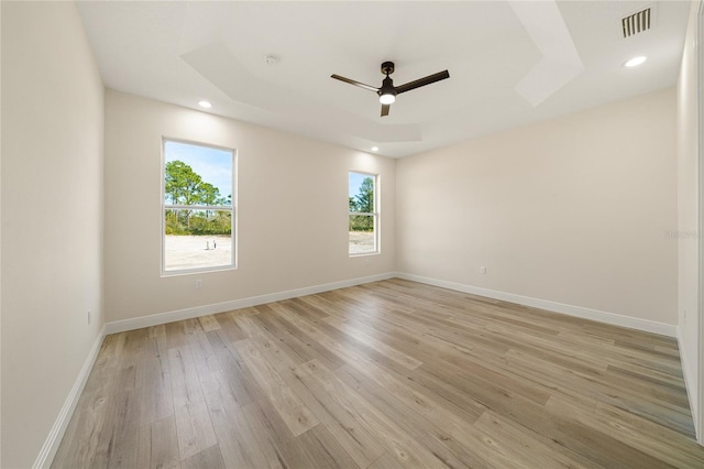 empty room with light hardwood / wood-style flooring and ceiling fan