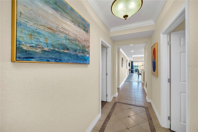 hall featuring crown molding and light tile flooring