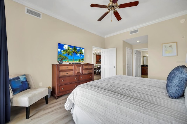 bedroom featuring light hardwood / wood-style flooring, ornamental molding, and ceiling fan with notable chandelier